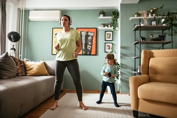 A young mom and daughter  doing exercise